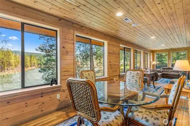 where large windows bring in natural light and showcase the serene mountain setting.