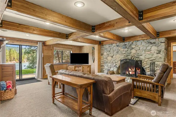 A beautifully crafted lower level lounge  with exposed beams