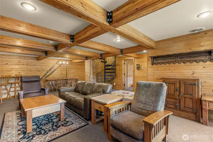 and a dramatic river rock fireplace, embodying true alpine charm