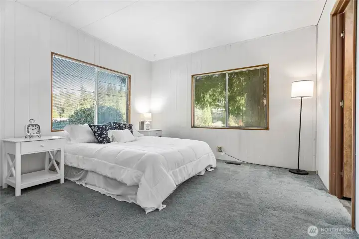 Lake views from every window in the primary bedroom!