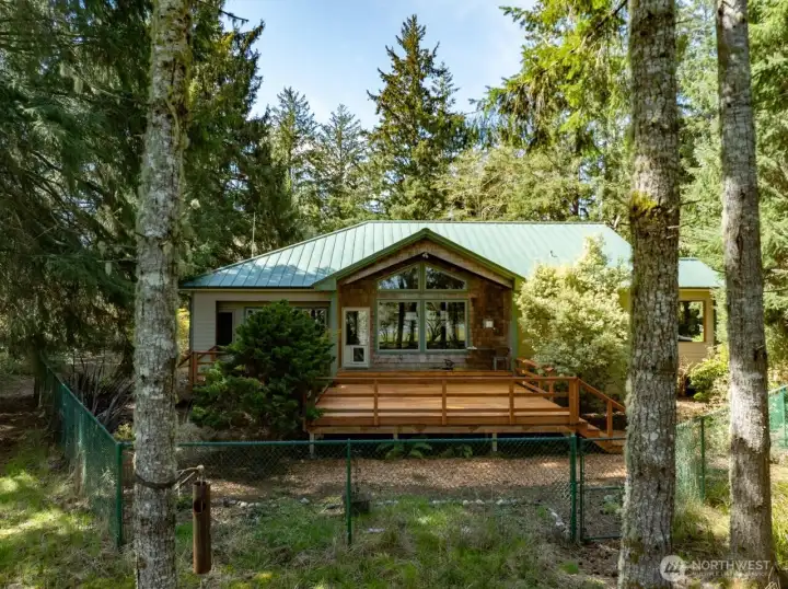 Bayside of the home with large windows to take in the view.