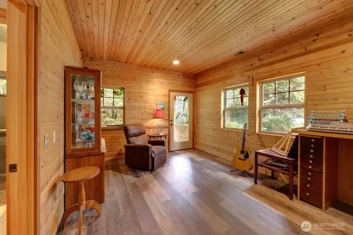 This guest suite is comfortably sized with a door to a private porch with a Bayview.