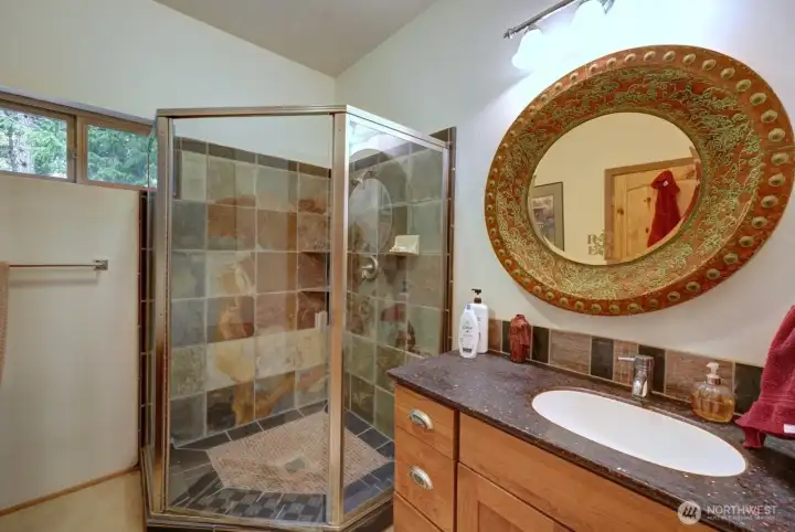 Shower with stone siding.