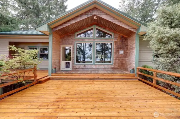 On the bayside looking at the Great Room and to the left is the private deck for the Primary bedroom.