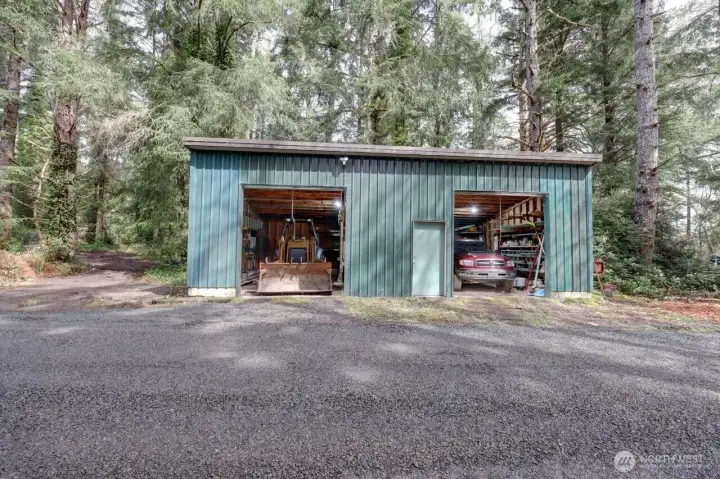 On the grounds is a metal outbuilding to store large equipment or some classic cars.  Not shown is the greenhouse.