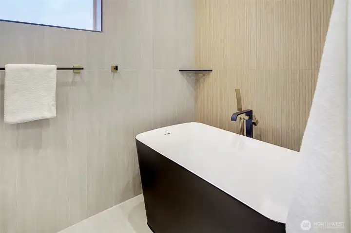stand alone soaking tub to get away from it all in your primary bathroom