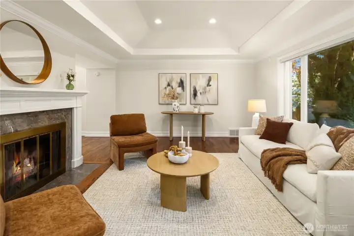 Light-filled living room with fireplace and refined finishes.