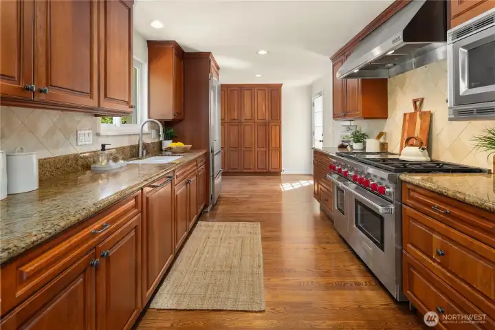Well-appointed kitchen with ample cabinetry and workspace