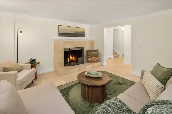 Additional living area anchored by a fireplace, offering warmth and flexibility.