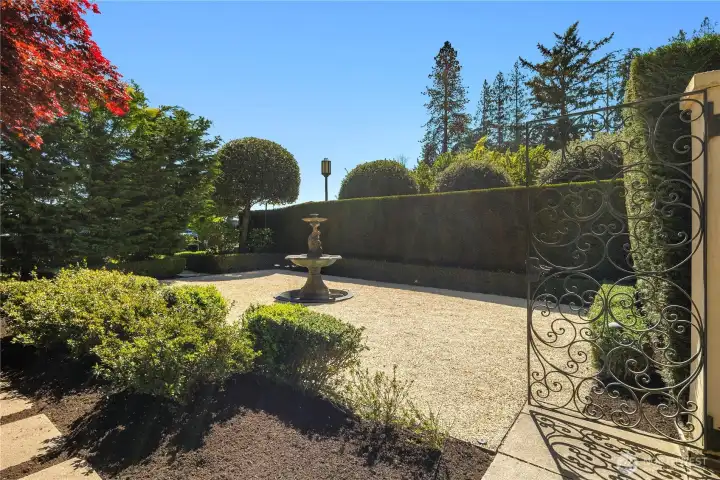 A courtyard setting welcomes you, unfolding like a true exterior great room.