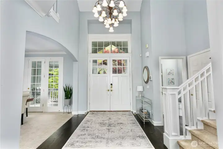 Foyer with soaring ceilings and chandelier