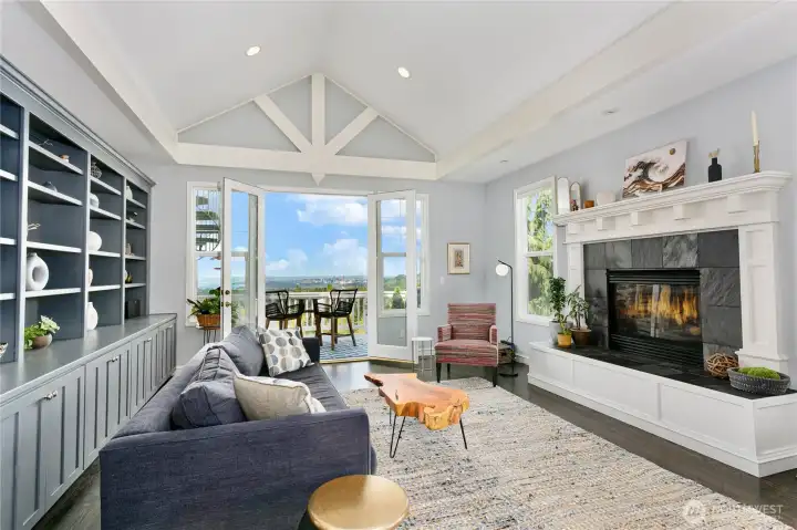Family room with fireplace, built-in bookcase, and breathtaking views