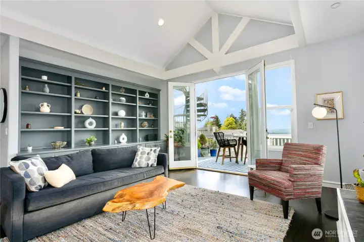 Family room with fireplace, built-in bookcase, and breathtaking views