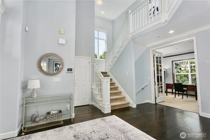 Foyer with stairs to upstairs and basement