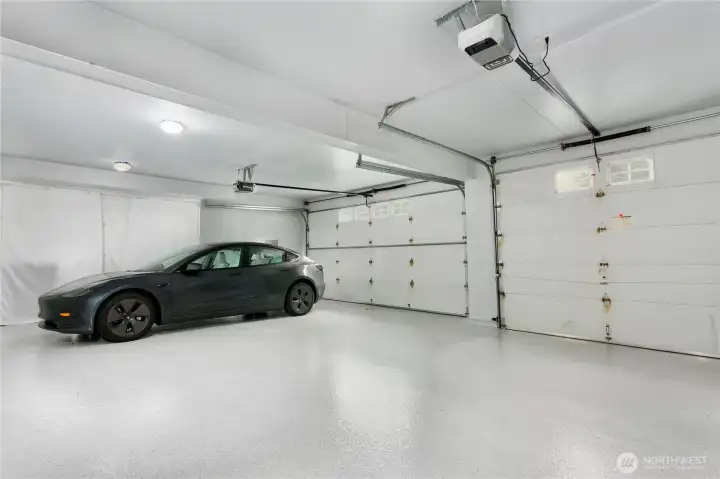 3-car garage with recently finished floors and lots of storage