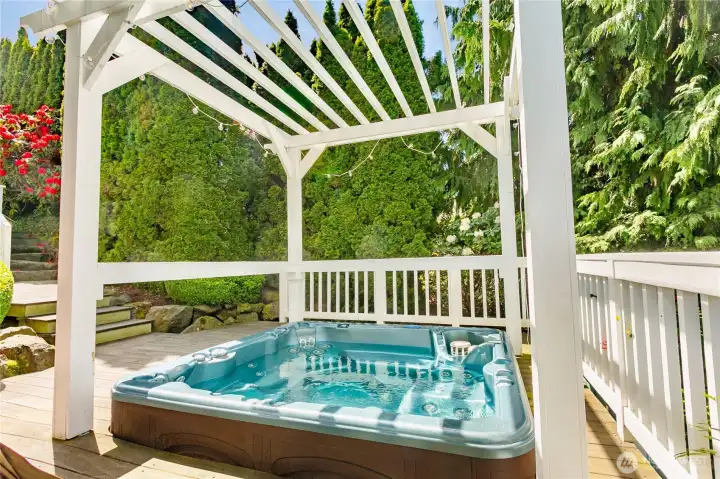 Private hot tub (conveys with sale)