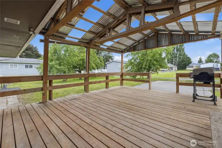 A covered back patio perfect for year-round grilling and entertaining.