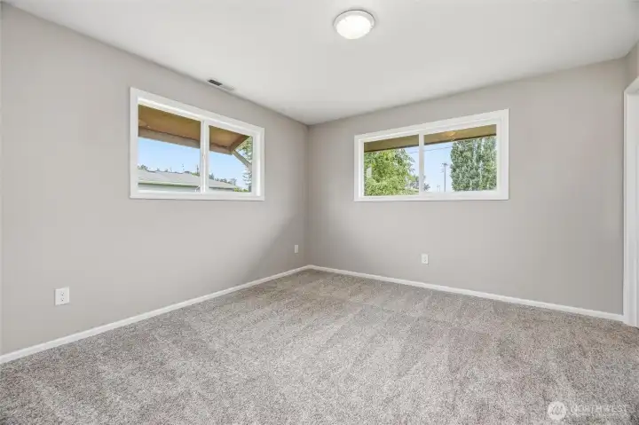 Lots of windows in the home provide natural lighting throughout.