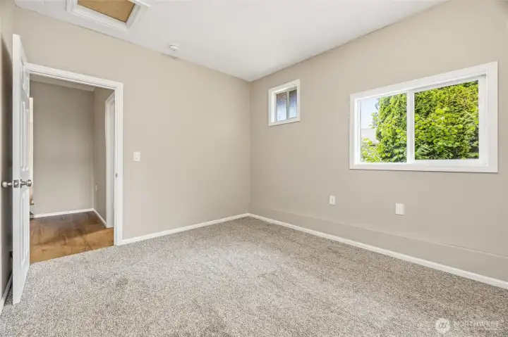 Extra room off the Bonus room makes a great den or office space with easy access to the back entry of the home.