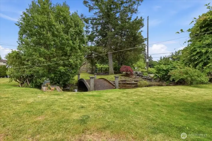 Front yard, bridge over the pond and waterfall