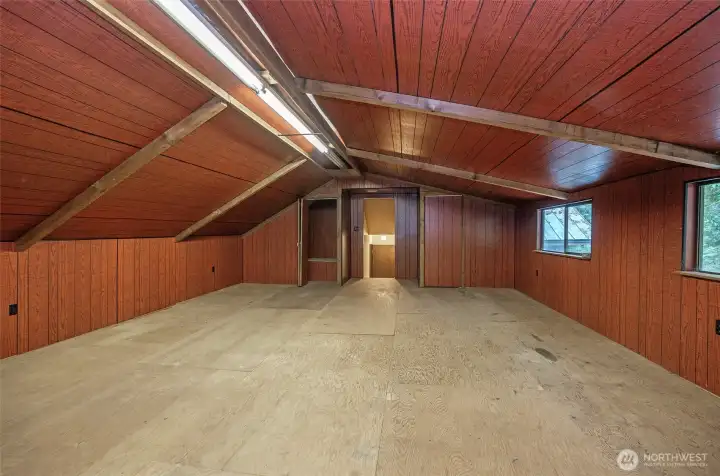 Partially finished attic space offering endless possibilities.