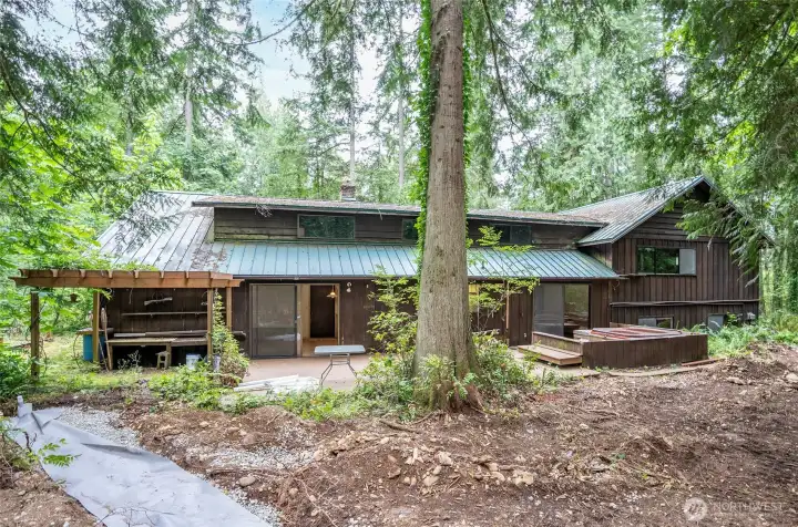 View from the rear of the property showcasing the natural surroundings.