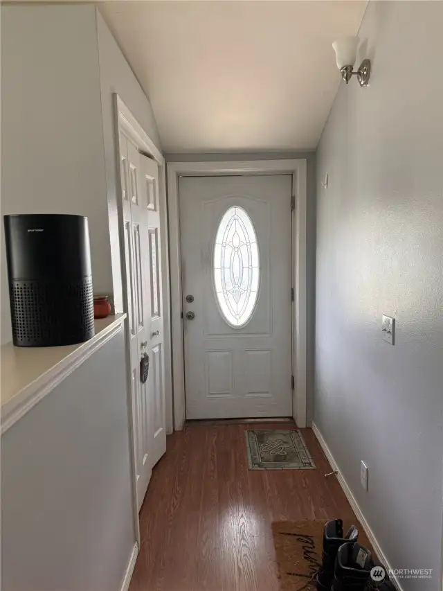 Hallway inside side door, coat closet