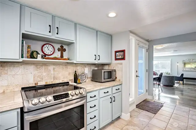 New appliances and cabinets, tile backsplash.