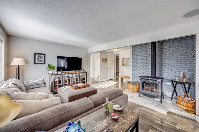 Living room with cozy natural gas fireplace.