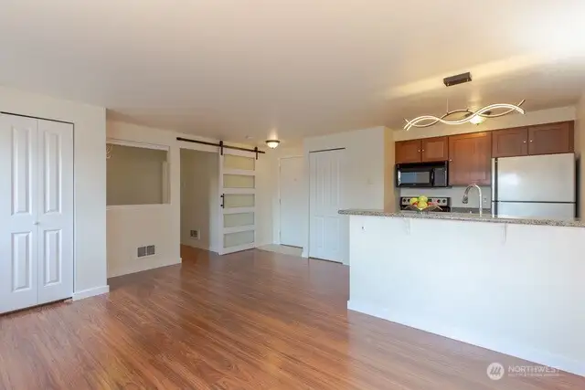 The Open Concept bedroom and living areas are perfect.  updated lighting fixtures, flooring and more