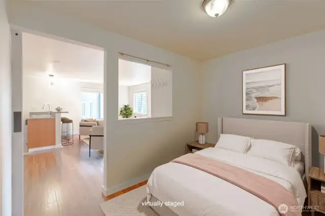 This open concept bedroom opens and feels a part of the whole place, great privacy with the barn door and the opening which has blinds for more privacy