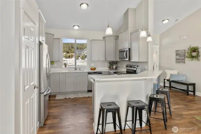 Spacious kitchen with ample storage and counter space.