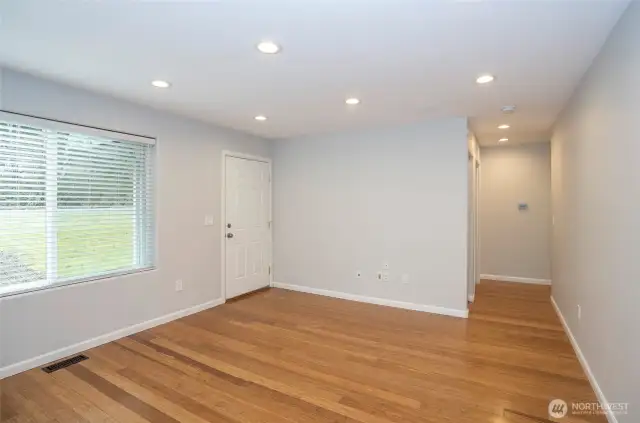 A welcoming hallway guiding you to the bedrooms and bathrooms.