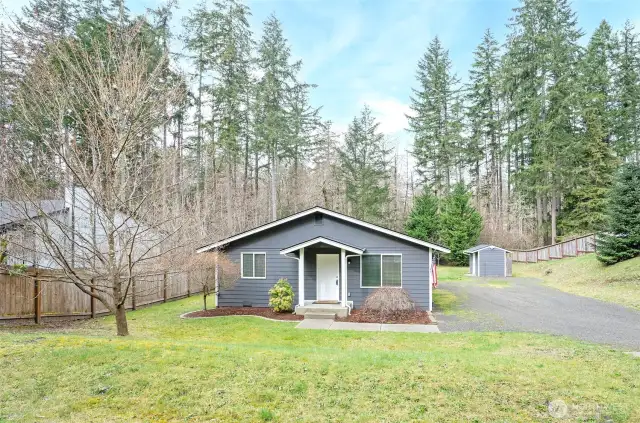 Street view of this beautifully maintained home situated on a spacious 13,500 SF lot.