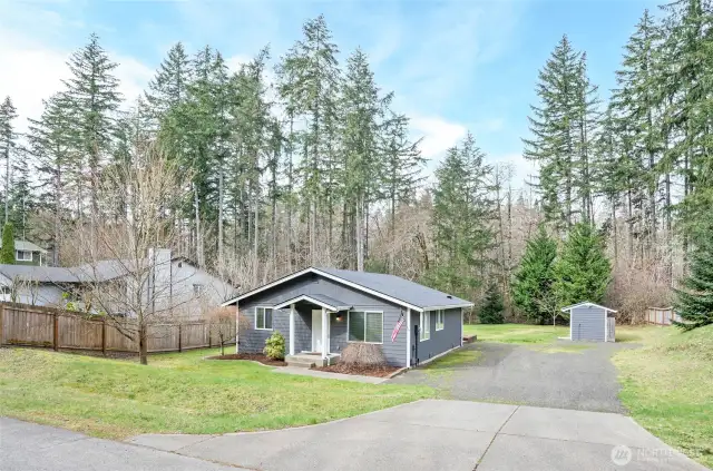 The expansive 13,500 SF lot features partial fencing, offering enhanced privacy and versatility.