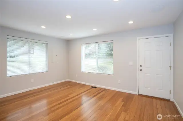 Expansive windows bathe the living area in abundant natural light.