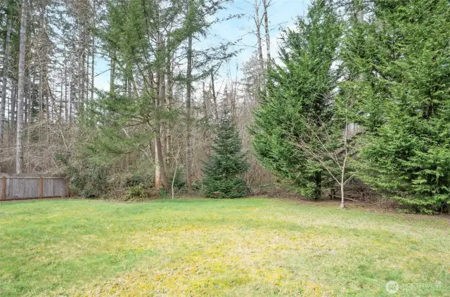 The greenbelt adds privacy and seclusion to this lot.