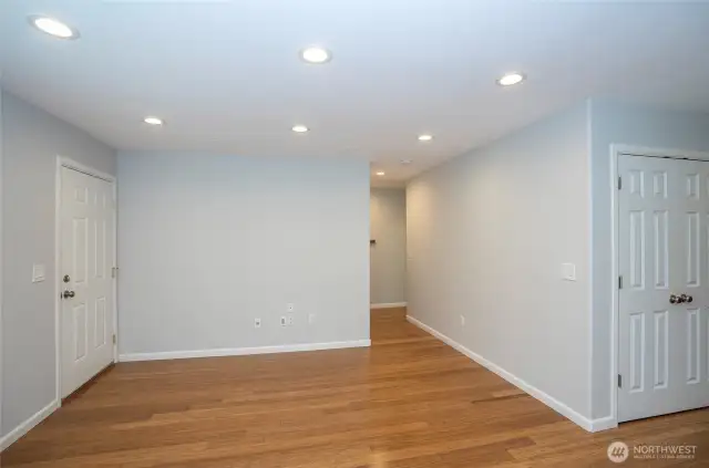 Living area illuminated by recessed lighting.