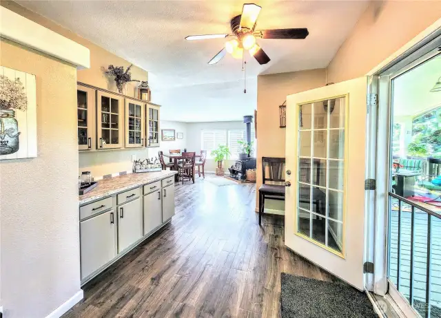 Formal dining area with built-in hutch exits to covered deck.
