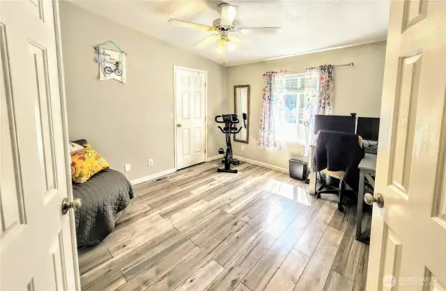 Secondary bedroom has french door entry.