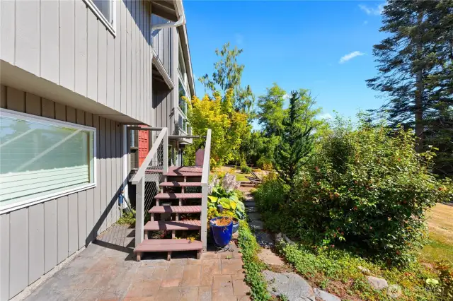 Front entry faces the large yard and open space.