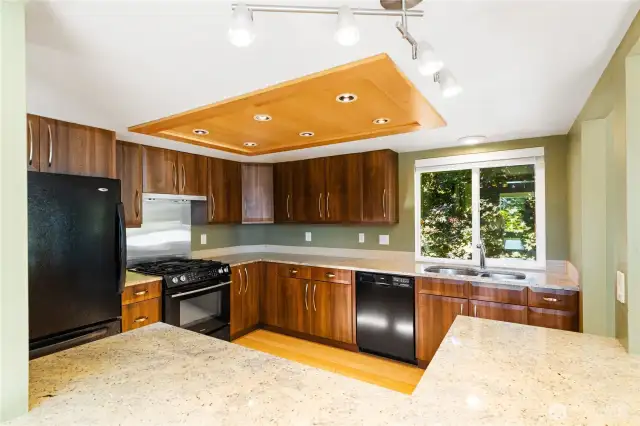 Pass-thru window makes the kitchen feel connected to the living but allows for separation.