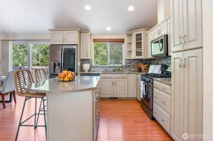 Chefs kitchen with top of the line appliances. beautiful spacious counters. Lots of cabinet space for storing all appliances.