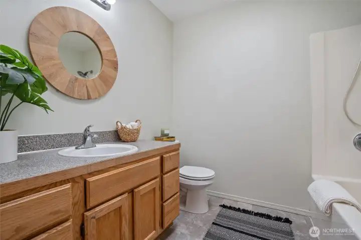 secondary bathroom with shower & tub combo.