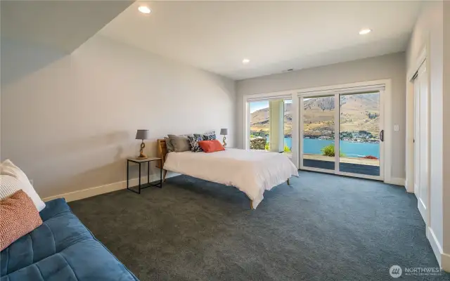 Bedroom three is at the other end of the house downstairs. Another huge room with deck and views to match the others! This one also has room for a double futon so it comfortable can sleep 4. If you wanted to add more bunks there is room for that, too!