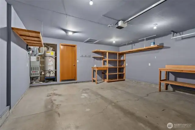 Two car garage with built in shelving.