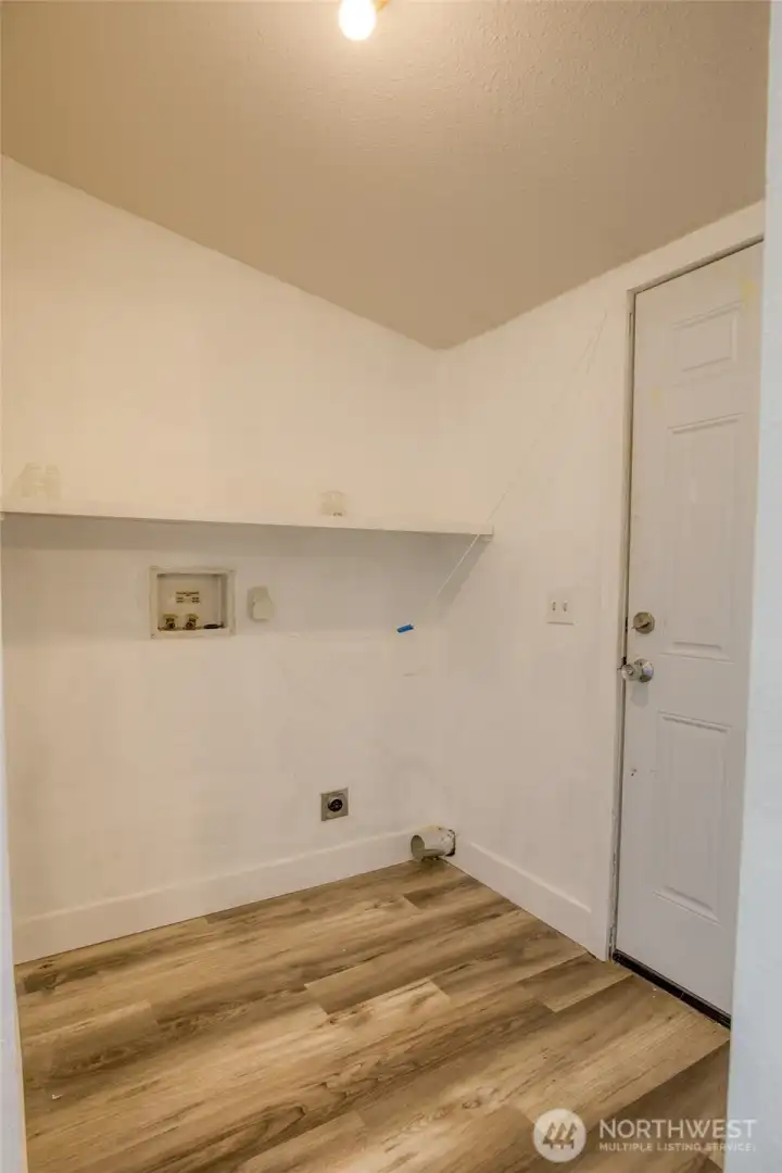 Laundry room with door to back deck