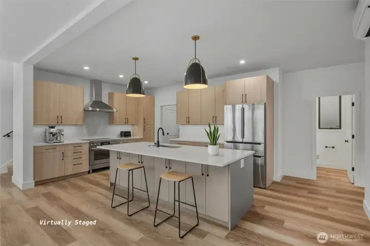 A view of the kitchen with high end appliances