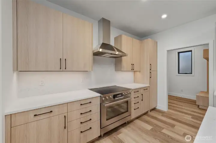 An oversized range is a highlight in the kitchen.