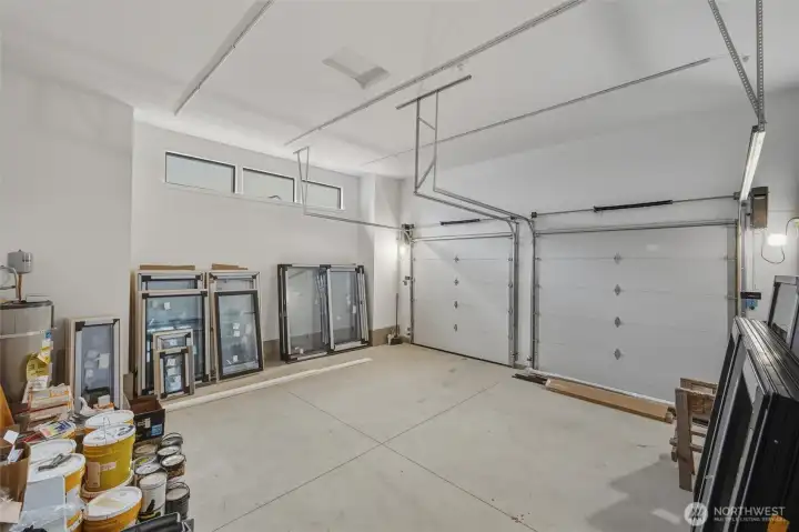 A massive 2 car garage with tall ceilings and tall doors - large enough for a sprinter van!